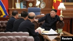 North Korean leader Kim Jong Un meets with the delegation that had visited the United States, in Pyongyang, in this photo released by North Korea's Korean Central News Agency, Jan. 23, 2019.