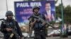 Members of the Cameroonian Gendarmerie patrols in the Omar Bongo Square of Cameroon's majority anglophone South West province capital Buea on October 3, 2018 during a rally in support of Cameroonian President Paul Biya.