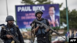 FILE - Members of the Cameroonian Gendarmerie patrol during a rally in support of Cameroonian President Paul Biya, Oct. 3, 2018.