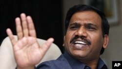 Indian Communications and Information Technology Minister A. Raja gestures while replying to journalists' questions (file photo)