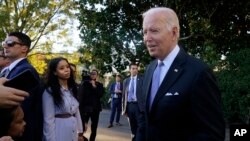 President Joe Biden talks with reporters on the South Lawn of the White House in Washington on Nov. 8, 2021.