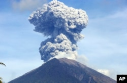 Mount Agung spews ash and smoke in Karangasem, Bali, Indonesia, July 3, 2018
