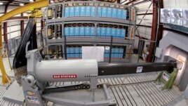 This Thursday, Feb. 23, 2012, file photo provided by the U.S. Navy, shows an electromagnetic railgun prototype launcher at the Naval Surface Warfare Center, Dahlgren Division test facility in Dahlgren, Va. (U.S. Navy photo by John F. Williams via AP, File