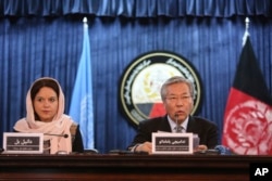 FILE - Tadamichi Yamamoto, United Nations Special Representative of the Secretary-General for Afghanistan (right) speaks during a press conference with Danielle Bell, United Nations Assistance Mission in Afghanistan, UNAMA, Human Rights Director, to discuss the release of the U.N. 2016 Annual Report on the Protection of Civilians in Armed Conflict, in Kabul, Afghanistan, Feb. 6, 2017.