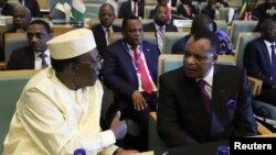 Chad President Idriss Deby talks to Republic of Congo President Denis Sassou Nguesso during the High Level Consultation Meetings of Heads of State and Government on the situation in the Democratic Republic of Congo at the African Union Headquarters, Addis Ababa, Jan. 17, 2019.