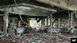 A Nigerian soldier secures the area at the United Nation's office following a suicide car bomb attack in Abuja, Nigeria, Aug. 27, 2011. (file photo) A primary goal of the forum is to support frontline states in transition develop justice systems that are