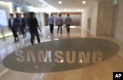 FILE - The corporate logo of Samsung Electronics Co. is seen at its shop in Seoul, South Korea, Oct. 12, 2016.