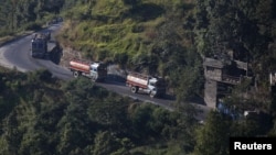 Nepalese petrol tankers heading to the Chinese border of Kerung are pictured on a road on the outskirts of Kathmandu, Nepal, Nov. 2, 2015. 