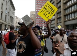 FILE - Members of the African National Congress (ANC) protest outside the party's headquarters in downtown Johannesburg, Feb. 5, 2018 calling for President Jacob Zuma to step down.