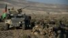 Afghan security forces take positions following an operation against Islamic State militants in the Pachir Agam district of Nangarhar province, Dec. 3, 2016. 