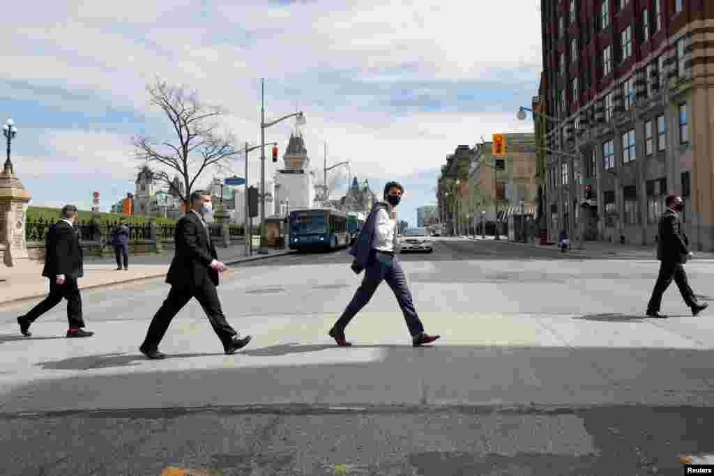 Canada's Prime Minister Justin Trudeau walks to a news conference, as efforts continue to help slow the spread of the coronavirus disease (COVID-19), in Ottawa, Ontario, April 13, 2021.