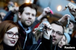 Demonstrators rattle keys during a protest called "Let's stand for decency in Slovakia" in reaction to the murder of Slovak investigative reporter Jan Kuciak and his fiancee, Martina Kusnirova, in Bratislava, Slovakia, March 9, 2018.