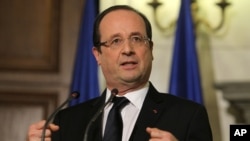 French President Francois Hollande gestures speaks during a news conference in Athens, Greece, February 19, 2013.