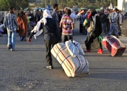 FILE - Ethiopian immigrants returning from Saudi Arabia arrive at Addis Ababa’s Bole International Airport on Dec. 10, 2013.