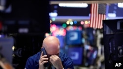 A trader talks on his phone on the floor of the New York Stock Exchange, Jan. 2, 2019.