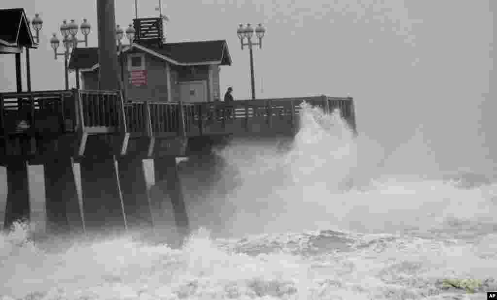 Large waves generated by Hurricane Sandy crash into Jeanette's Pier in Nags Head, N.C., Saturday, Oct. 27, 2012 as the storm moves up the east coast. 