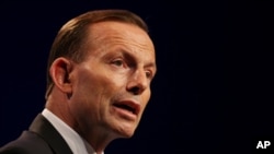 FILE - Australia's Prime Minister Tony Abbott speaks to the media during a press conference at the conclusion of the G-20 summit in Brisbane, Australia.