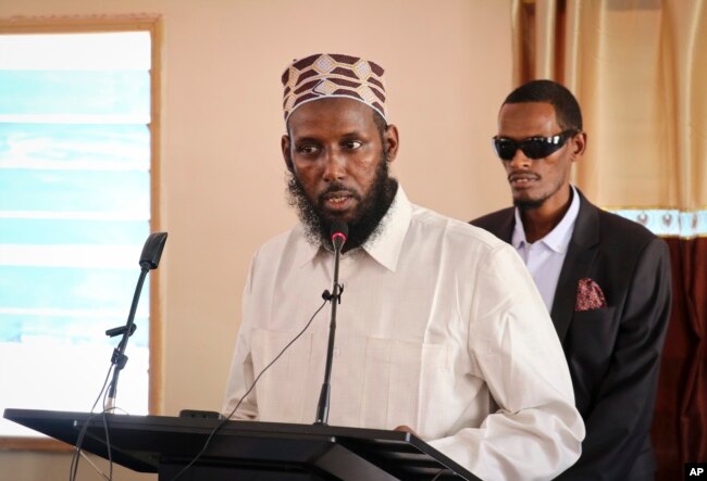 FILE - Mukhtar Robow, once deputy leader of Africa's deadliest Islamic extremist group the al-Shabab, speaks at a press conference about his candidacy for a regional presidency, in Baidoa, Somalia, Oct. 10, 2018.