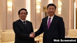 Trưởng ban Đối ngoại Trung ương Hoàng Bình Quân (trái) hội kiến Chủ tịch Trung Quốc Tập Cận Bình. Ảnh: TTXVN (Ảnh chụp màn hình trang web vnexpress.net)
