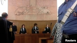 President of the court Giulia Turri (C) reads the sentence for former Italian prime minister Silvio Berlusconi in Milan, June 24, 2013.