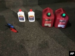 This photo posted on the New York Police Department's Twitter page shows gas cans and lighter fluid that a New Jersey man was seen carrying as he entered St. Patrick’s Cathedral in New York, April 17, 2019.