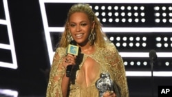 Beyonce accepts the award for best female video for “Hold Up” at the MTV Video Music Awards at Madison Square Garden on Aug. 28, 2016, in New York. 