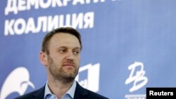 FILE - Russian opposition leader Alexei Navalny attends a news conference on opposition joint efforts at local elections in 2015 in Moscow, April 22, 2015.