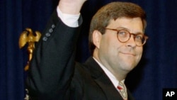 FILE - William Barr waves, having been sworn in as U.S. attorney general, in Washington, Nov. 26, 1991, during the administration of President George H.W. Bush.