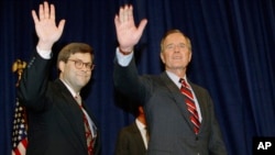 FILE - In this Nov. 26, 1991, photo, President George H.W Bush, right, and William Barr wave after Barr was sworn in as the new attorney general of the United States in Washington. President Donald Trump said Friday he would nominate Barr to serve in the 
