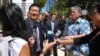 Hawaii Attorney General Douglas Chin speaks outside federal court in Honolulu, March 29, 2017. 