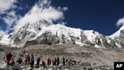 Trekkers rest at Mount Everest Base Camp, Nepal, Sept. 27, 2015.