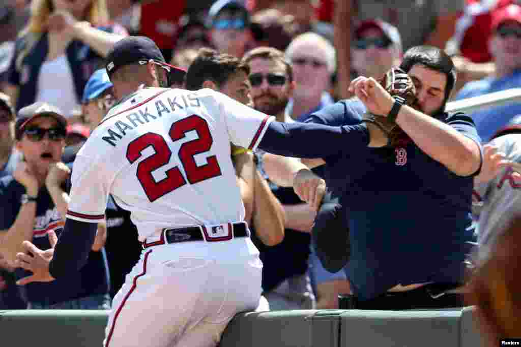 Atlanta Braves right fielder Nick Markakis (22) catches a fly ball near the stands against the Boston Red Sox in the fifth inning at SunTrust Park in Atlanta, Georgia, Sept. 3, 2018. (Credit: Brett Davis - USA TODAY Sports)