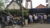 Onlookers gather outside of St. Lidwina Church following an attack in Sleman, Yogyakarta province, Indonesia, Feb. 11, 2018. Police shot a sword-wielding man who attack the church during a mass, injuring a number of people.