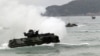 Amphibious assault vehicles prepare to hit the ground at a join military exercise, 'Cobra Gold' on Hat Yao beach in Chonburi province eastern, Thailand, February 10, 2012. 