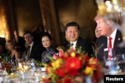 Chinese President Xi Jinping and First Lady Peng Liyuan attend a dinner hosted by U.S. President Donald Trump at Trump's Mar-a-Lago estate in West Palm Beach, Florida, April 6, 2017.