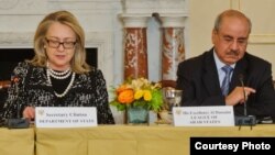 FILE - Then-U.S. Secretary of State Hillary Clinton is pictured with Arab League Ambassador Mohammed Al Hussaini Al Sharif in January 2013. (Credit: Arab League Office)