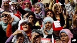 Egyptian women chant slogans as they attend a demonstration in Tahrir Square in Cairo, Egypt, April 1, 2011.