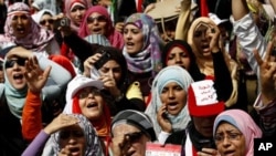 Egyptian women chant slogans as they attend a demonstration in Tahrir Square in Cairo, Egypt, April 1, 2011.
