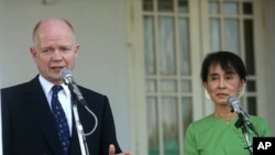 Britain's Foreign Secretary William Hague talks to reporters after meeting with Myanmar pro-democracy leader Aung San Suu Kyi at her home in Rangoon January 6, 2012