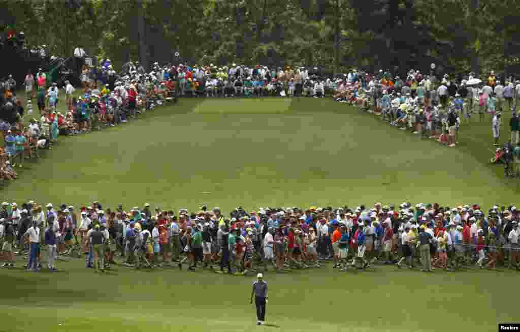 Jordan Spieth of the U.S. walks up the eighth fairway during second round play of the Masters golf tournament at the Augusta National Golf Course in Augusta, Georgia.