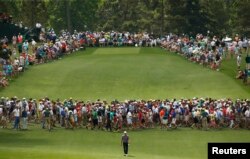 Jordan Spieth of the U.S. walks up the eighth fairway during second round play of the Masters golf tournament at the Augusta National Golf Course in Augusta, Georgia, April 10, 2015.