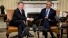 President Barack Obama shakes hands with Colombian President Juan Manuel Santos during their meeting in the Oval Office of the White House, in Washington, Feb. 4, 2016.