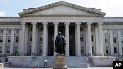FILE - A statue of former Treasury Secretary Albert Gallatin is seen outside the Treasury Building in Washington, DC.