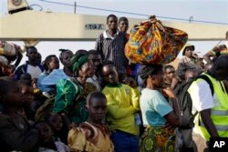 FILE - In this image taken May 23, 2015, refugees who fled Burundi arrive in Kigoma, Tanzania, after making the journey on Lake Tanganyika.