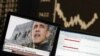 A TV showing news on re-elected U.S. President Barack Obama is pictured in front of the German share price index DAX board at the German stock exchange in Frankfurt, November 7, 2012.