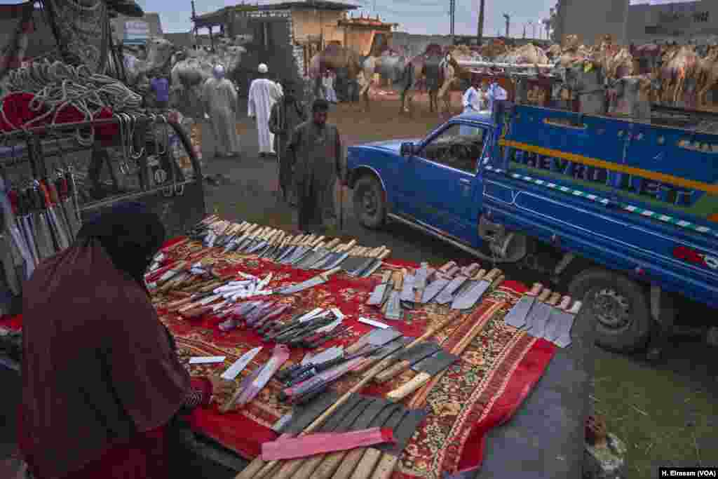 Other businesses like selling knives and slaughtering tools set up alongside the camel trading business at the Birqash market.