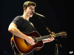 Shawn Mendes performs as the opener for Taylor Swift during The 1989 World Tour at the Georgia Dome on October 24, 2015, in Atlanta.