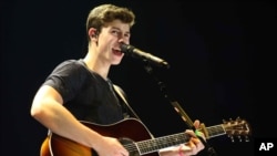 Shawn Mendes performs as the opener for Taylor Swift during The 1989 World Tour at the Georgia Dome on Oct. 24, 2015, in Atlanta. 