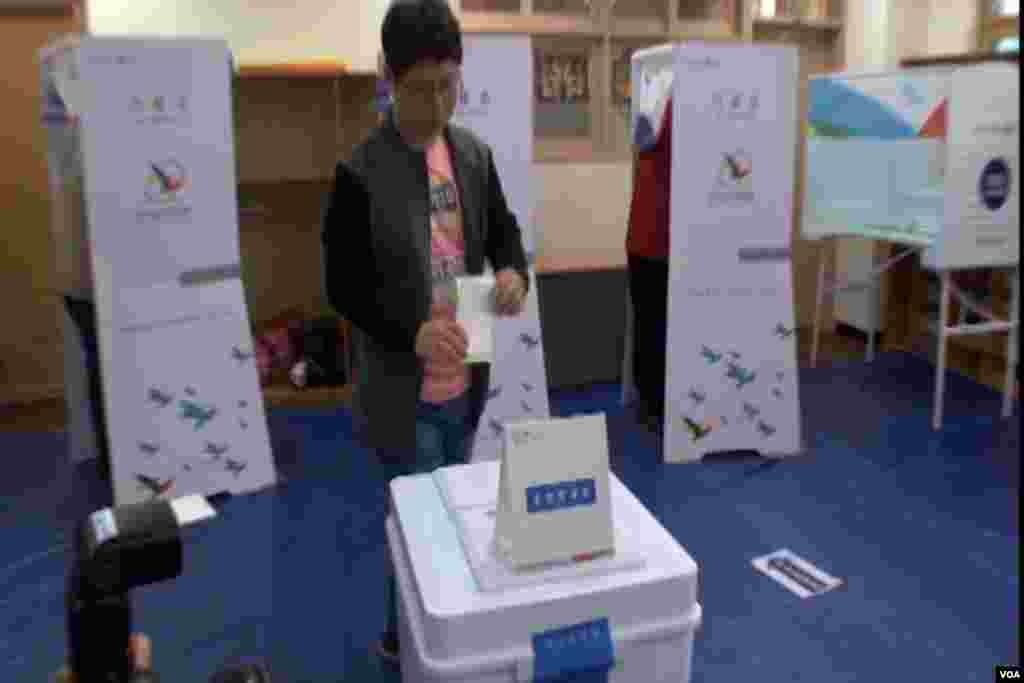 A South Korean male approaches the ballot box and casts his vote in Tuesday's election.