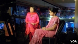 Barkha Dutt, (in red dress) Group Editor, NDTV. (Photo: Deepak Dobhal / VOA)